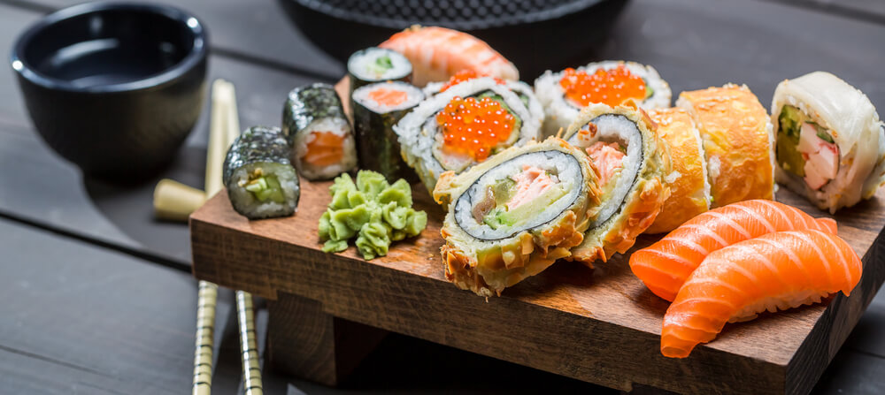 Closeup of fresh sushi on wooden board